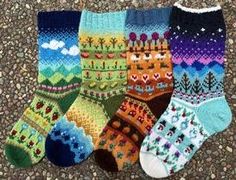 five pairs of colorful socks sitting on the ground