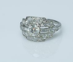 an antique style diamond ring with three rows of diamonds