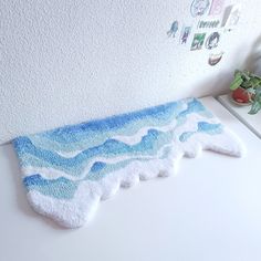 there is a towel shaped like a wave on the counter