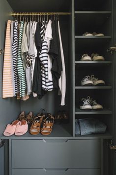 an organized closet with clothes and shoes