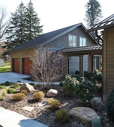 a house that has some rocks in front of it