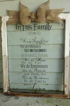 an old window frame with a bow on it that says in this family, we do not