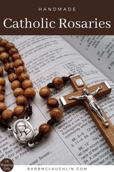 a rosary with the words, handmade catholic rosarys on it and an open book