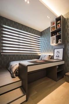 a bed sitting under a window next to a desk with drawers on top of it