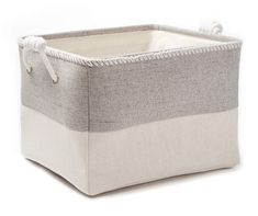 a gray and white storage basket with handles