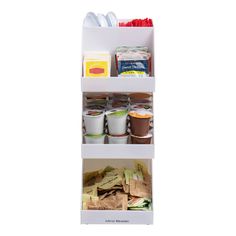 three shelves filled with food and condiments on top of each other in front of a white background