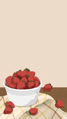 a bowl of strawberries sitting on top of a table