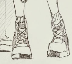 a drawing of someone's feet wearing boots with laces on the soles