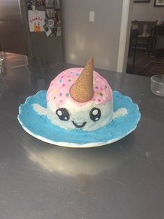 a birthday cake with an ice cream cone on top