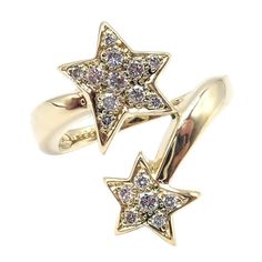 Chanel Comete 18k Yellow Gold Diamond Cocktail Stars Ring sz 6.5 Welcome to Fortrove Payment / Shipping / Returns STORE HOME About Us NEW ARRIVALS ENDING SOON Add to Favorites FEEDBACK Contact Us Chanel Comete 18k Yellow Gold Diamond Cocktail Stars Ring sz 6.5 Product Description About This Piece: The Authentic Chanel Comète 18k Yellow Gold Star Diamond Cocktail Ring is an exquisite and glamorous piece of jewelry.  Crafted from 18k yellow gold, this ring features a stunning star design adorned with diamonds.  The diamonds sparkle and add a touch of luxury to the piece.  The attention to detail is evident in the intricate craftsmanship, making it a true representation of Chanel's iconic style.  This cocktail ring is a statement accessory that exudes elegance and sophistication, perfect for Mythical Mermaids, Rings Multiple, Chanel Ring, Brilliant Cut Diamond Ring, Vintage Cocktail Ring, Yellow Gold Diamond Ring, Gold Statement Ring, Gold Cocktail Ring, Gold Cocktail