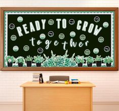 a wooden desk with a blackboard on it that says, ready to grow together