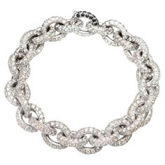 The bracelet is a chain model, and is made up of twenty-seven round links on which 30.76 ct of white diamonds are set. The bracelet is in 18 Kt white gold. The closure of the bracelet is perfectly invisible, to be able to distinguish it, the diamonds on the closure are white. • The bracelet is in 18 Kt gold • Total diamond size: ct 30.76 • Weight of the bracelet: 61.00 grams • Length of the bracelet: 19.5 cm •Single Piece • It is possible to combine the bracelet with white diamonds with a bracelet with black diamonds. In this case the two bracelets can also be worn together as a necklace. •THE MANUFACTURE IS MADE IN ITALY •THE JEWEL IS IN 18 KT GOLD •EACH ITEM IS SOLD WITH THE BAGLIONI JEWELERY GUARANTEE CERTIFICATE, WHICH CERTIFIES THE CHARACTERISTICS AND AUTHENTICITY OF THE STONES AND MA Von Dutch Hat, Flawless Diamond, Piazza Navona, Modern Bracelets, Expensive Jewelry Luxury, Rene Lalique, Von Dutch, Expensive Jewelry, Diamonds And Gold