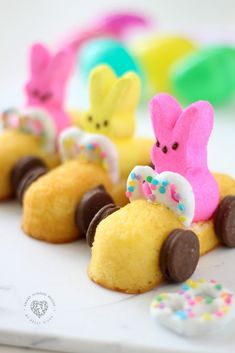 some little bunnies that are sitting in the shape of animals on top of doughnuts