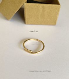 This solid 14k gold ring band is adjustable and make great gifts or Bridesmaids gifts.  I handcraft each one to order. If you are not sure of the persons rings size or your fingers well these are great rings and very comfortable.  The ring makes a great thumb ring because it can fit over your knuckle and then be adjusted a little smaller to fit your thumb snugly. These rings are solid 14k Gold and will come in the Gift box shown. If you would like something special please send me a note :)  Free Thumb Rings For Women, Stacking Rings Gold, Ankle Bracelets Gold, Gold Thumb Rings, Wide Gold Ring, Gold Stacking Rings, Round Wedding Band, Wide Silver Ring, Copper Gifts