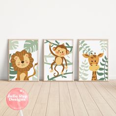 three children's wall art prints featuring monkeys and giraffes