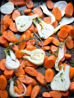 chopped carrots and onions on a baking sheet