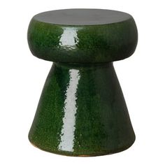 a green stool with white stripes on it