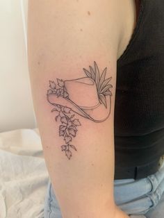 black line tattoo on forearm, a cowboy hat with ivy draping off of it, along with an aloe-looking plant behind it Babylon Tattoo, Cowboy Like Me Tattoo, The Gardens Of Babylon, Cowboy Like Me, Cowgirl Tattoos, Cowboy Tattoos, Me Tattoo, Country Tattoos, Gardens Of Babylon