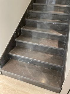 a set of marble steps leading up to a door