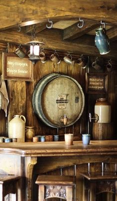 there are many wine barrels hanging on the wall