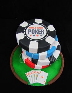 a cake that is on top of a table with poker chips and cards around it