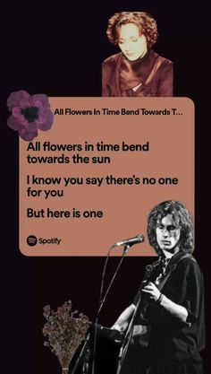 a woman standing at a microphone in front of a sign that says, all flowers in time bend towards the sun i know you say there's no one but here is one