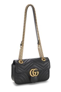 Find GUCCI Gg Marmont Shoulder Bag on Editorialist. This Gucci GG Marmont Shoulder Bag features a quilted design, a gold-tone logo, and a chain strap. It can be worn on the shoulder or crossbody. Luxury Crossbody Shoulder Bag With Gold Chain, Gucci Shoulder Bag With Gold-tone Logo For Everyday Use, Gucci Shoulder Bag With Gold-tone Logo Plaque, Chic Gucci Shoulder Bag With Metal Logo, Gucci Travel Bag With Chain Strap, Luxury Shoulder Bag With Gold Chain, Gucci Gold Bag With Gold-tone Logo Plaque, Luxury Gold Quilted Bag, Luxury Quilted Gold Bag