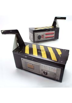 an old radio with a yellow and black hazard tape on it