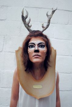 a woman with fake antlers on her head is shown in an instagramtion