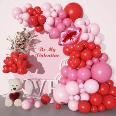 a valentine's day backdrop with balloons and a teddy bear