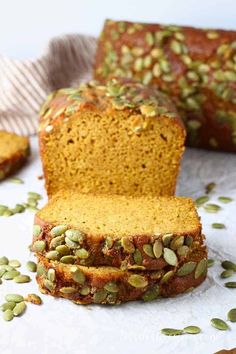 sliced loaf of pumpkin bread with seeds on top