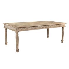 an old wooden table with ornate carvings on the top and legs, against a white background