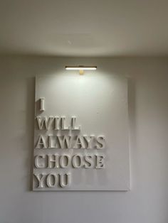 a white room with a sign that says i will always choose you