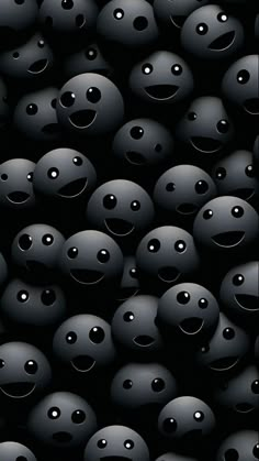 many black balls with faces and eyes are shown in the dark room, as if they were floating or floating on water