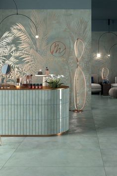 the interior of a modern salon with large mirrors and plants on the wall behind the counter