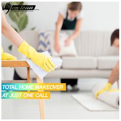 two women in yellow gloves cleaning a living room