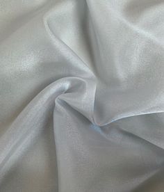 the white fabric is very soft and shiny