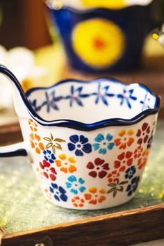 Add charm to your daily routine with these delightful flower mugs, designed for comfort and style. Featuring whimsical floral patterns and a wide four-finger grip, they’re perfect for coffee, tea, or hot cocoa. Each mug comes with a matching spoon, making every sip as practical as it is enjoyable. Crafted from quality porcelain, these mugs are a joy to use and a thoughtful gift for any occasion.