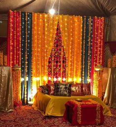 a decorated stage with lights and decorations for a wedding or other special event in india