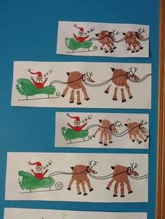 three handprints depicting santa claus pulling his reindeer sleigh