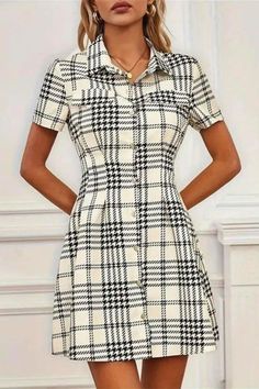 This women’s mini dress features short sleeves and a classic plaid pattern with a stylish lapel collar. Perfect for casual wear or day outings, its chic design offers a blend of comfort and sophistication. A versatile addition to any wardrobe, ideal for a polished yet relaxed look. Casual Plaid A-line Dress, Casual A-line Plaid Dress, Casual White Dress With Placket, Short Sleeve Plaid Dress For Fall, Casual Collared Mini Dress For Work, Casual Plaid Short Sleeve Dress, Casual Plaid Midi Dress For Work, Casual Short Sleeve Plaid Dress With Buttons, Casual Plaid Short Sleeve Dress With Buttons