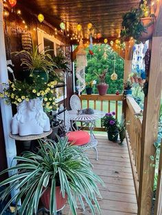 a porch with potted plants and lights