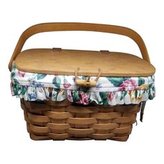 a wooden basket with flowers on it