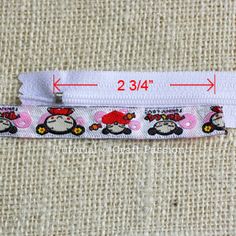 a white zipper with hello kitty on it and the measurements for each zipper are shown