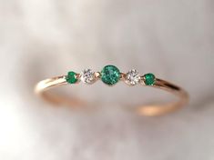 Emerald stacking ring, Emerald and Diamond Ring, Minimalist Ring, Diamond Ring, Dainty Diamond Ring, Dainty Emerald Ring, Stacking ringBeautiful gold 5 stones emerald and diamond ring. Available in Sterling Silver/9k/14k yellow, rose or white gold. Same design can be made also with other custom gemstones per request. Product details:- Solid gold- approx 2.5 and 1.5 mm emerald- 2 mm diamond (F G, VS - SI)- Band size is 1.2 mm- Made to order - 8 to 10 business days.Ring size - US 3 to US 9 (for sm Small Green Ring, Small Emerald Ring, Minimalist Green Diamond Ring For Wedding, Minimalist Green Diamond Wedding Ring, Dainty Gold Emerald Ring, Dainty Emerald Ring, Emerald Stacking Ring, Emerald Ring Stack, Emerald Ring Simple