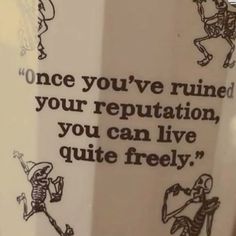 a coffee cup with skeletons on it saying once you've ruined your reputation, you can live quite freely