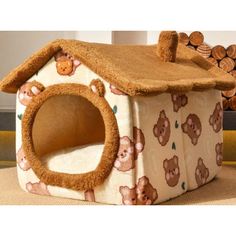 a dog house with teddy bears on the front and sides, made out of fabric