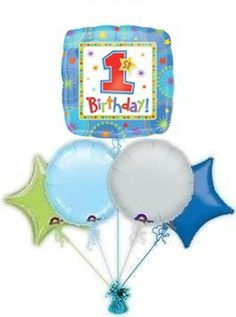 the 1st birthday balloon bouquet is blue, green, and white with stars on it