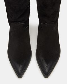 Crafted from high-quality suede, the STETSON boot exudes a rugged Western charm. Its pointed toe design adds a touch of sophistication, making it the perfect option for any occasion. Don't compromise on style or comfort with this versatile and durable boot. 2.75 inch heel height 12.5 inch shaft circumference 8.25 inch shaft height Suede upper material Unlined Synthetic sock Synthetic sole Imported Western Boots Women, Western Boot, Toe Designs, Western Boots, Women's Boots, Black Suede, Steve Madden, Heel Height, Heels