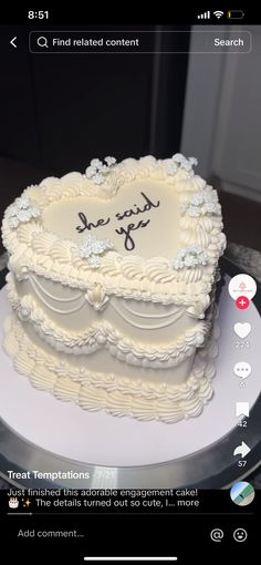 a heart shaped cake with writing on the side and an image of someone's handwritten message